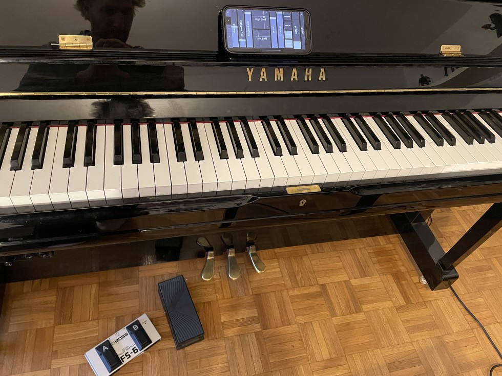 Piano setup with foot controlers and smartphone touch interface
